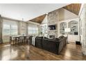 Inviting living room with a stone fireplace, built-in bookshelves, and large windows for natural light at 157 Lake Forrest Ne Ln, Atlanta, GA 30342