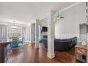 Open-concept living room with hardwood floors, fireplace, and bright, natural light at 2995 Barimore, Dacula, GA 30019