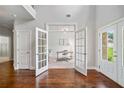 Bright office featuring French doors, hardwood floors, and ample natural light at 4460 Hunters Walk Way, Cumming, GA 30028