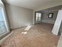 Dining area with bright windows, a chandelier, and decorative chair rail molding at 138 Shady View Pl, Lawrenceville, GA 30044