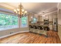 Gourmet kitchen featuring stainless steel appliances, granite countertops, and a breakfast bar with counter seating at 4655 Barnes Ct, Loganville, GA 30052