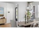 Elegant dining room featuring modern lighting, stylish decor, and comfortable seating for Gathering and guests at 4820 Gadwall Way, Cumming, GA 30028