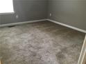 Neutral bedroom offering plush carpeting, ample natural light, and fresh paint at 318 Bakers Bridge Cir, Douglasville, GA 30134