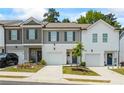 Charming townhome with a one-car garage and a well-maintained front yard at 3481 Lakeview Crk, Lithonia, GA 30038