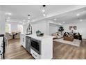 Open-concept kitchen with a large island, modern appliances, and seamless flow into the living area at 3290 Ethan Drive, Marietta, GA 30062