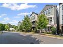 Street view of attractive townhomes with well-kept lawns, trees, and modern architectural details at 518 Hargrove Ln, Decatur, GA 30030