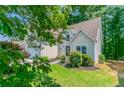Charming home featuring a well-kept lawn and manicured shrubbery at 12015 Harbour Town Pkwy, Fayetteville, GA 30215