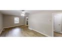 Spacious living room featuring new floors, a ceiling fan, and plenty of natural light at 568 Mcwilliams Se Rd, Atlanta, GA 30315