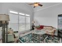 Bright and airy living room with vaulted ceiling and large windows at 1304 Swallows Walk, Grayson, GA 30017