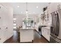 Modern kitchen featuring a large island, stainless appliances, and an open layout at 4202 Deming Cir, Sandy Springs, GA 30342