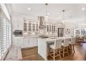 Modern kitchen featuring stainless steel appliances, pendant lighting, and an island with seating at 4202 Deming Cir, Sandy Springs, GA 30342