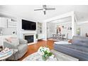 Bright living room featuring a fireplace, built-in shelves, and hardwood floors at 3690 Lambert Ne Ln, Atlanta, GA 30319