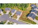Aerial view showcasing the layout of this community with manicured lawns and a cul-de-sac at 4117 Flat Rock Pt, Stonecrest, GA 30038