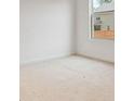 Bright bedroom with a window showing the exterior of the home at 4117 Flat Rock Pt, Stonecrest, GA 30038