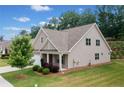 Exterior view of a craftsman-style home with well-maintained lawn at 151 Rolling Hills Pl, Canton, GA 30114
