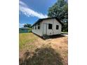 Simple home showcasing its practical design and outdoor space in a residential area at 50 Evelyn Rd, Covington, GA 30016