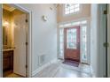 Beautiful foyer with high ceilings, chandelier, and decorative front door at 10280 Medridge Cir, Johns Creek, GA 30022