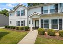 Beautiful front lawn and sidewalk leading up to the front door of the two story home at 5880 Garden Circle Cir, Douglasville, GA 30135
