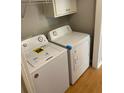 Convenient laundry area equipped with a washing machine and dryer at 5119 Hill Farm Ne Dr, Woodstock, GA 30188