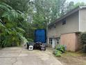 View of the house with a large truck parked in the driveway at 6649 Valley Hill Sw Dr, Mableton, GA 30126