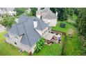 Aerial view of the rear exterior with a large deck, a covered patio, and a grassy backyard at 185 Beracah Sw Walk, Atlanta, GA 30331