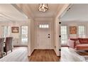 Bright foyer with hardwood floors, leading to a dining room and living room, perfect for entertaining at 5285 Bannergate Dr, Johns Creek, GA 30022