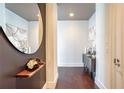 Inviting hallway with modern decor, wood floors, and stylish accents leading into the home at 1065 Peachtree Ne St # 3505, Atlanta, GA 30309