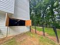 View of the garage exterior showing doors and access to the fenced backyard at 2990 Cove Crossing Dr, Lawrenceville, GA 30045