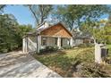 Street view of charming home with beautiful trees surrounding the property at 458 Holly Nw St, Atlanta, GA 30318