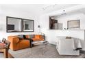 Comfortable living room with stylish seating, modern decor, and a view of the kitchen at 620 Peachtree Ne St # 1206, Atlanta, GA 30308
