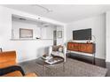 Cozy living area with a comfortable armchair, stylish console, and open space at 620 Peachtree Ne St # 1206, Atlanta, GA 30308