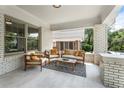 Relaxing covered front porch with comfortable seating and stylish outdoor rug at 504 Angier Ne Ave, Atlanta, GA 30308