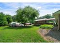 Large backyard with multiple outbuildings for storage, offering ample space and functionality at 81 Laurie Ct, Hiram, GA 30141