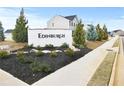Edinburgh community sign with landscaping and trees along the street at 105 Marchmont Dr, Locust Grove, GA 30248