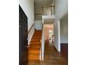Inviting entryway with hardwood floors and a staircase leading to the second floor at 2994 Abbotts Oak Way, Duluth, GA 30097