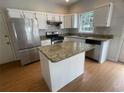 Functional kitchen with stainless steel appliances, granite countertops and an island at 2994 Abbotts Oak Way, Duluth, GA 30097
