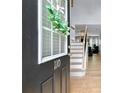 Inviting entryway with hardwood floors, a staircase and view into the living area at 110 Finchley Dr, Roswell, GA 30076