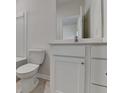Neutral bathroom featuring a toilet and vanity at 3587 Hidden Valley Cir, Lawrenceville, GA 30044