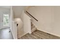 Staircase and back door with hardwood flooring at 3587 Hidden Valley Cir, Lawrenceville, GA 30044