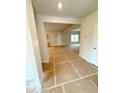 A view of the home's entryway showing an open floor plan and unfinished flooring at 120 Cedar Cliff Ct, Temple, GA 30179