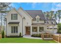 Charming two-story home featuring a welcoming front porch and well-manicured lawn at 4250 Summit Dr, Marietta, GA 30068