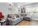 Comfortable living room featuring a plush gray sectional sofa with decorative pillows at 1174 Princess Sw Ave, Atlanta, GA 30310