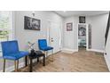 Cozy sitting area with two blue chairs and decorative art at 1174 Princess Sw Ave, Atlanta, GA 30310