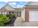 Charming entrance to a lovely home with a brick facade and well-kept landscaping at 3589 Garden Manor Dr, Loganville, GA 30052