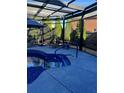 Inviting pool area featuring a covered pergola and stylish blue tiling at 704 Kenton Ct, Locust Grove, GA 30248