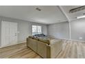 Comfortable living room featuring modern flooring, neutral walls, and access to an adjacent room at 3081 Frankie Ln, Duluth, GA 30096
