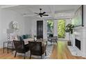 Cozy living room with a fireplace, comfortable seating, and views of the outdoors through large windows at 2196 Niles Ne Pl, Atlanta, GA 30324