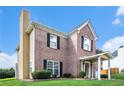 Two-story brick home showcasing green lawn, black shutters, and a covered front entryway at 2928 Riverset Ct, Decatur, GA 30034