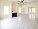 Bright living room with high ceilings, a fireplace, and large windows offering plenty of natural light at 2928 Riverset Ct, Decatur, GA 30034