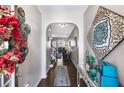 Elegant foyer with hardwood floors, tasteful decorations, and an arched entryway at 7628 Summer Berry Ln, Lithonia, GA 30038
